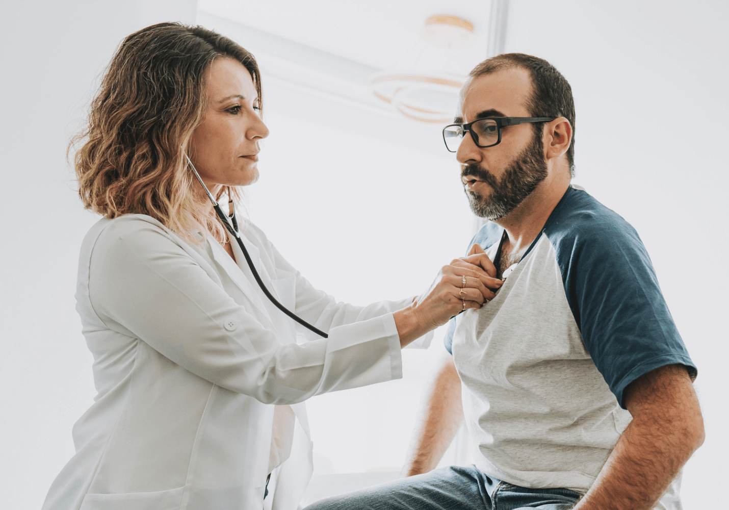 Doctor checking heartbeat